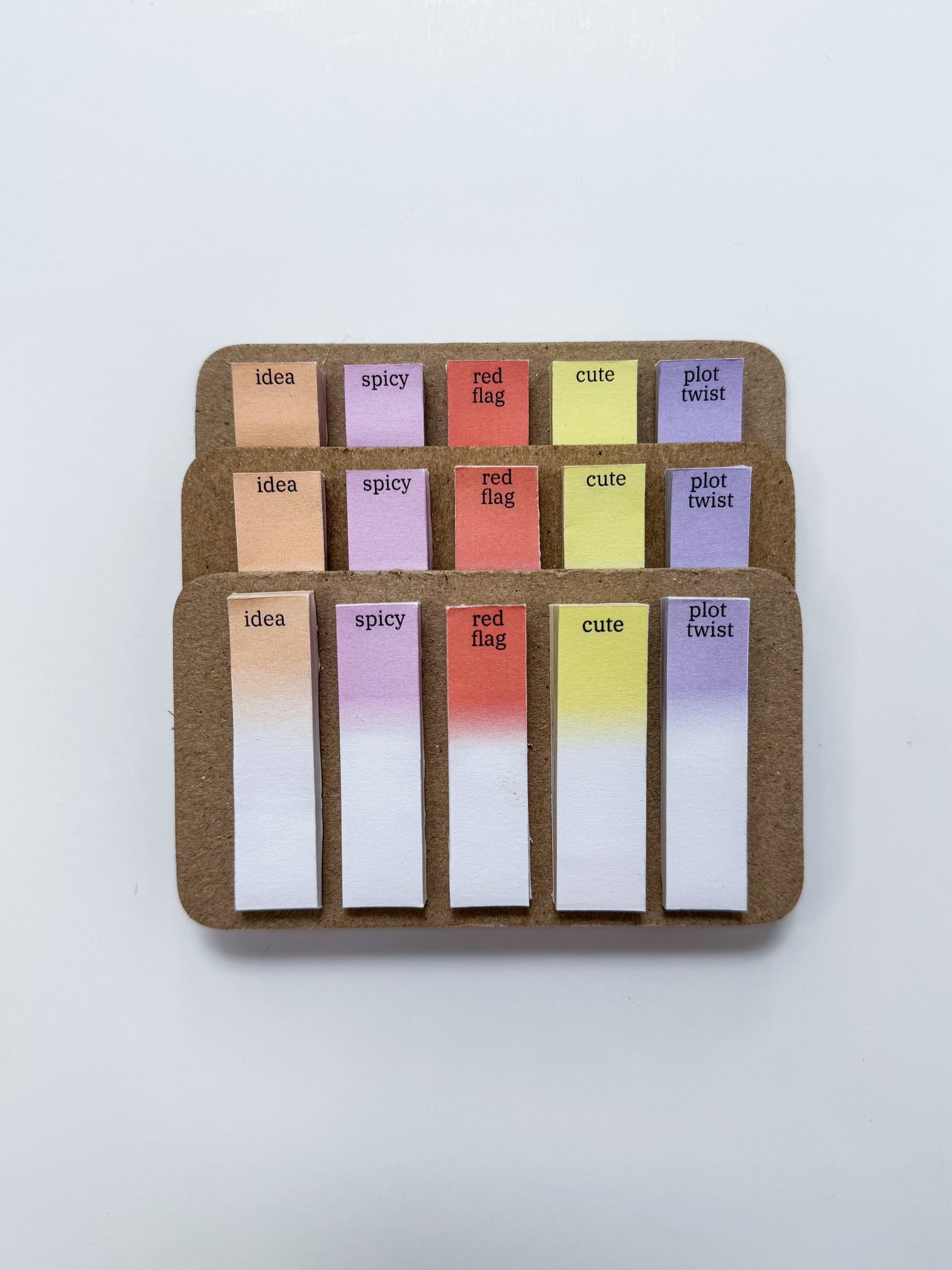 Set of colorful sticky notes with text on a white background