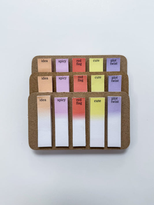 Set of colorful sticky notes with text on a white background