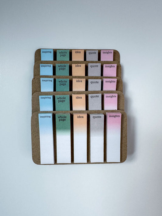 Set of colorful sticky notes with text on a white background