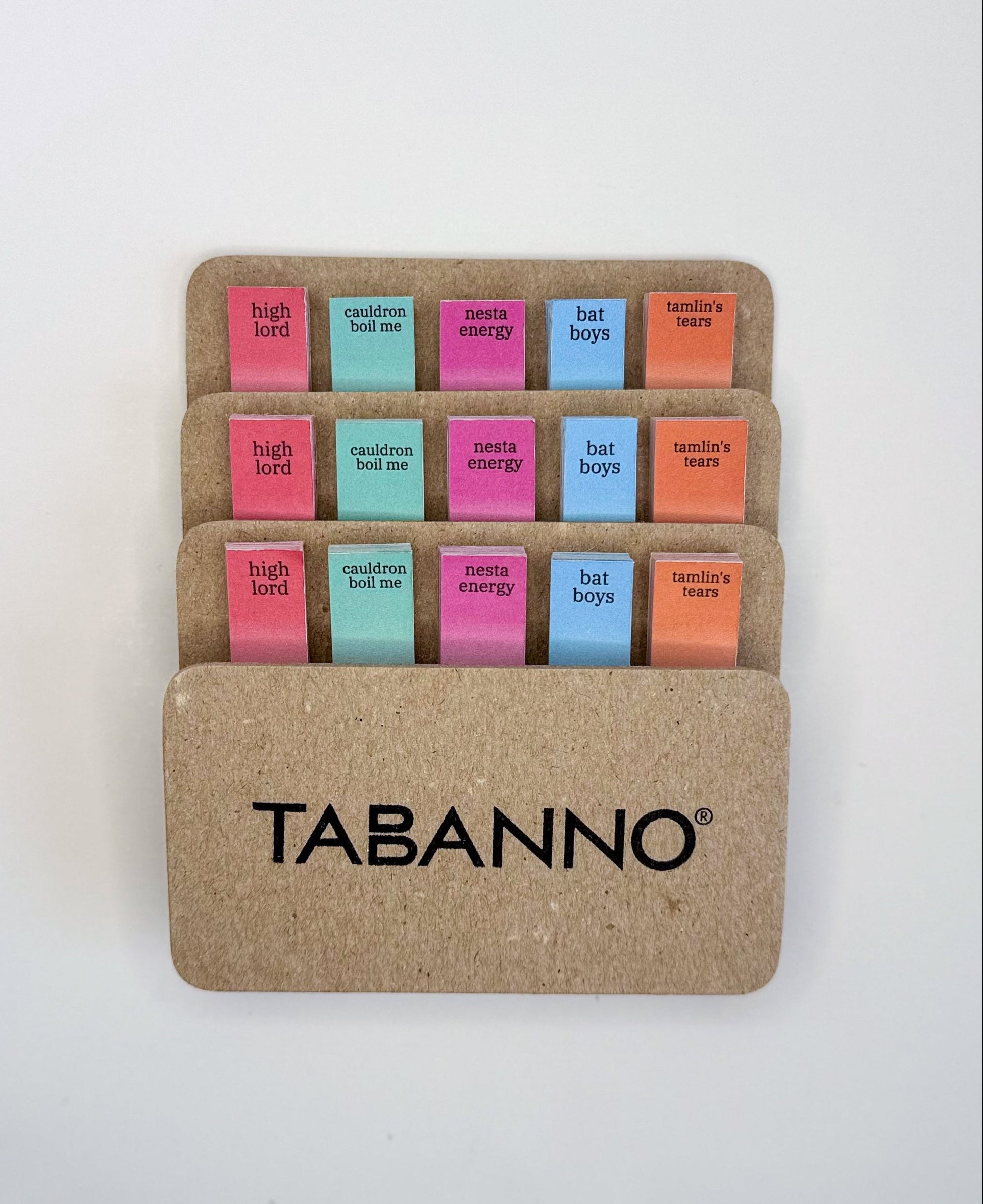 Set of colorful Tabanno sticky notes in a cardboard holder on a white background