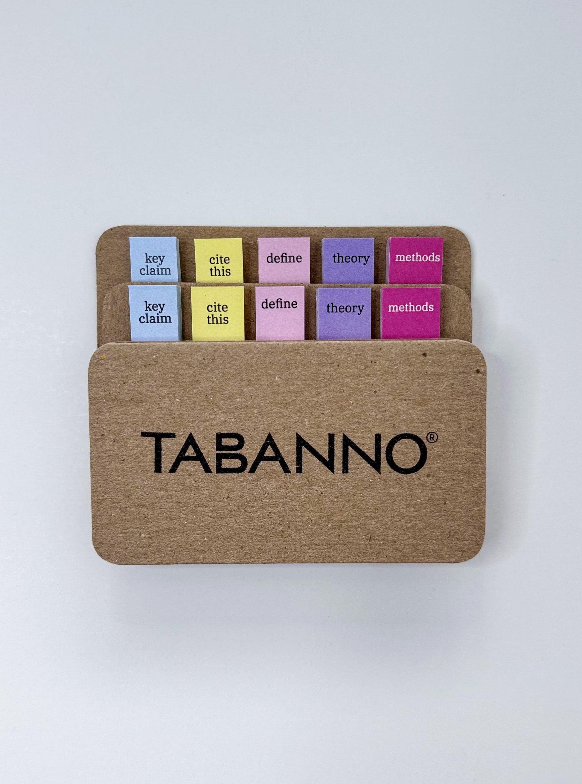 Set of colorful academic annotating tabs on cardboard with 'TABANNO' branding on a white background