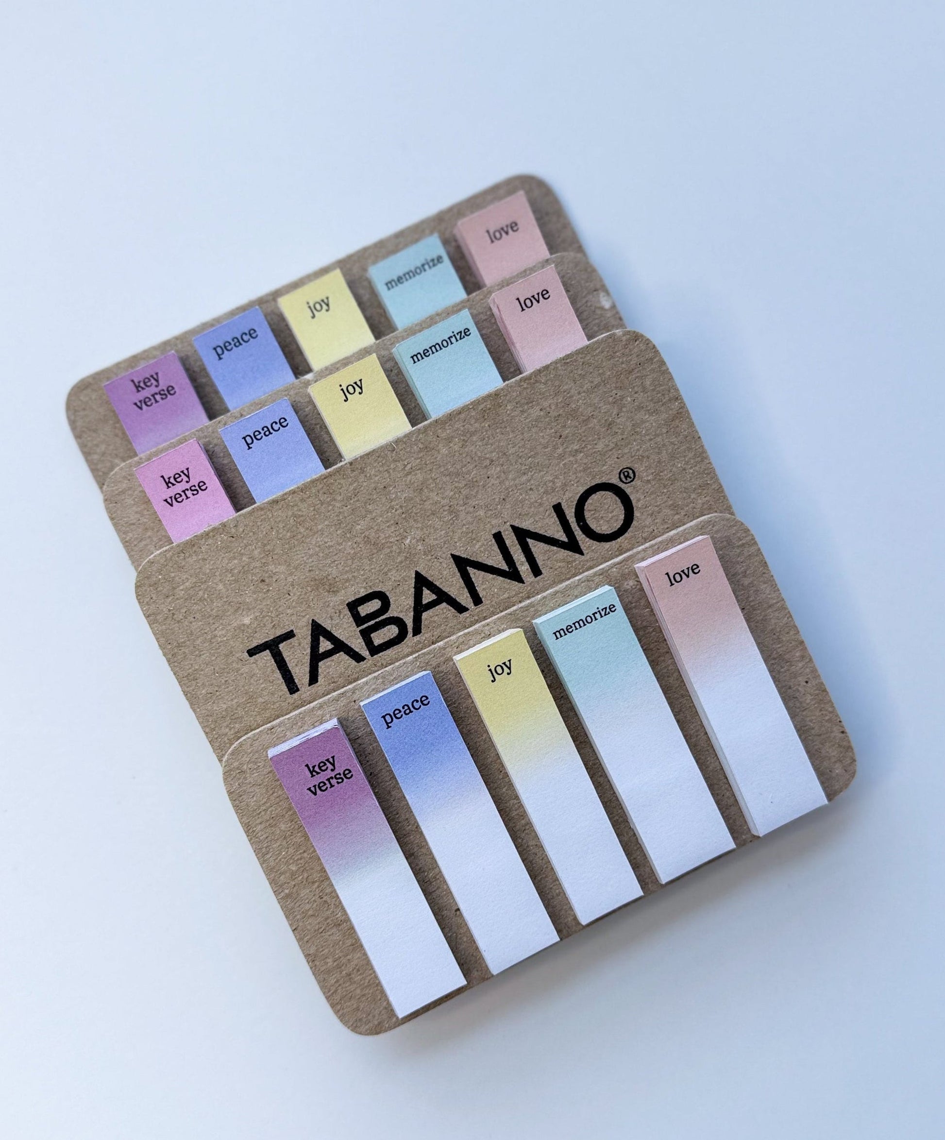 Set of colorful tabs with 'TABANNO' branding on a white