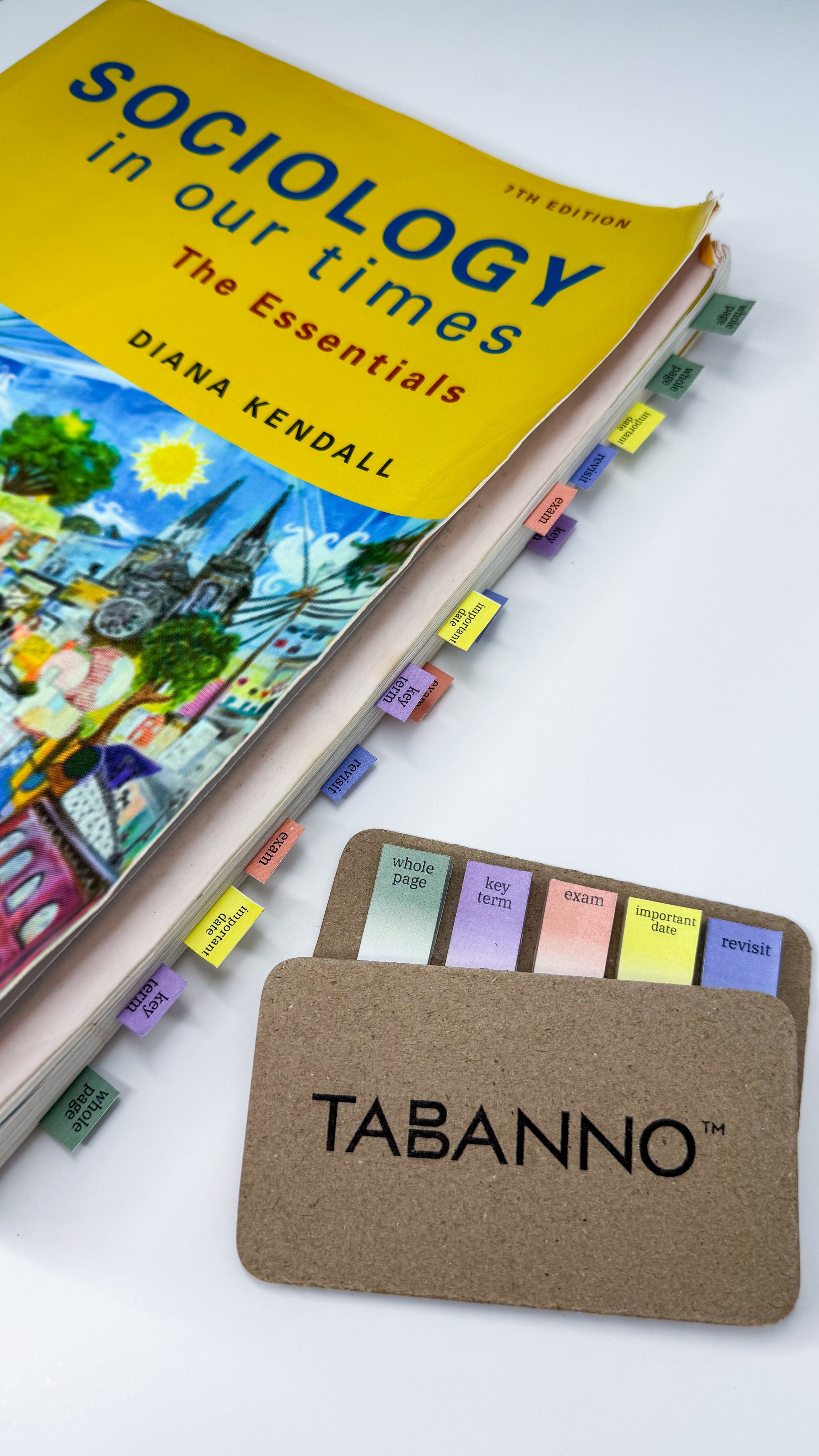 Book titled 'Sociology in Our Times: The Essentials' by Diana Kendall with a Tabanno sticky notes holder on a white background.