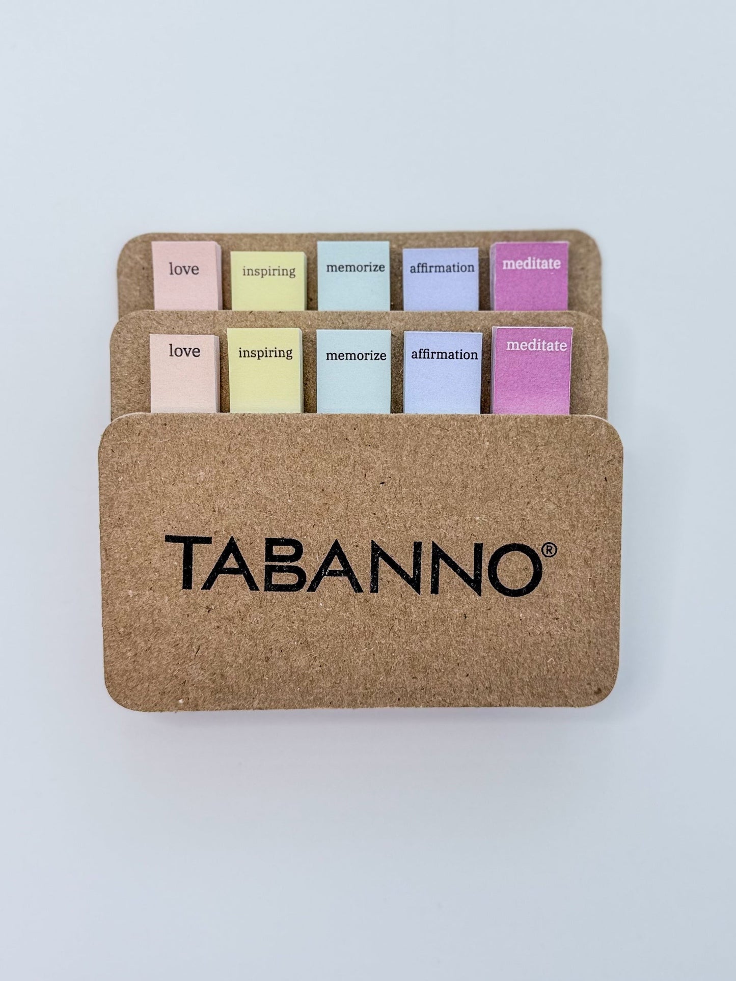 Set of colorful annotating tabs on a cardboard holder with 'TABANNO' branding on a white background